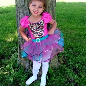 Pink and teal dance costume with sequins, puffed cap sleeves. Very cute